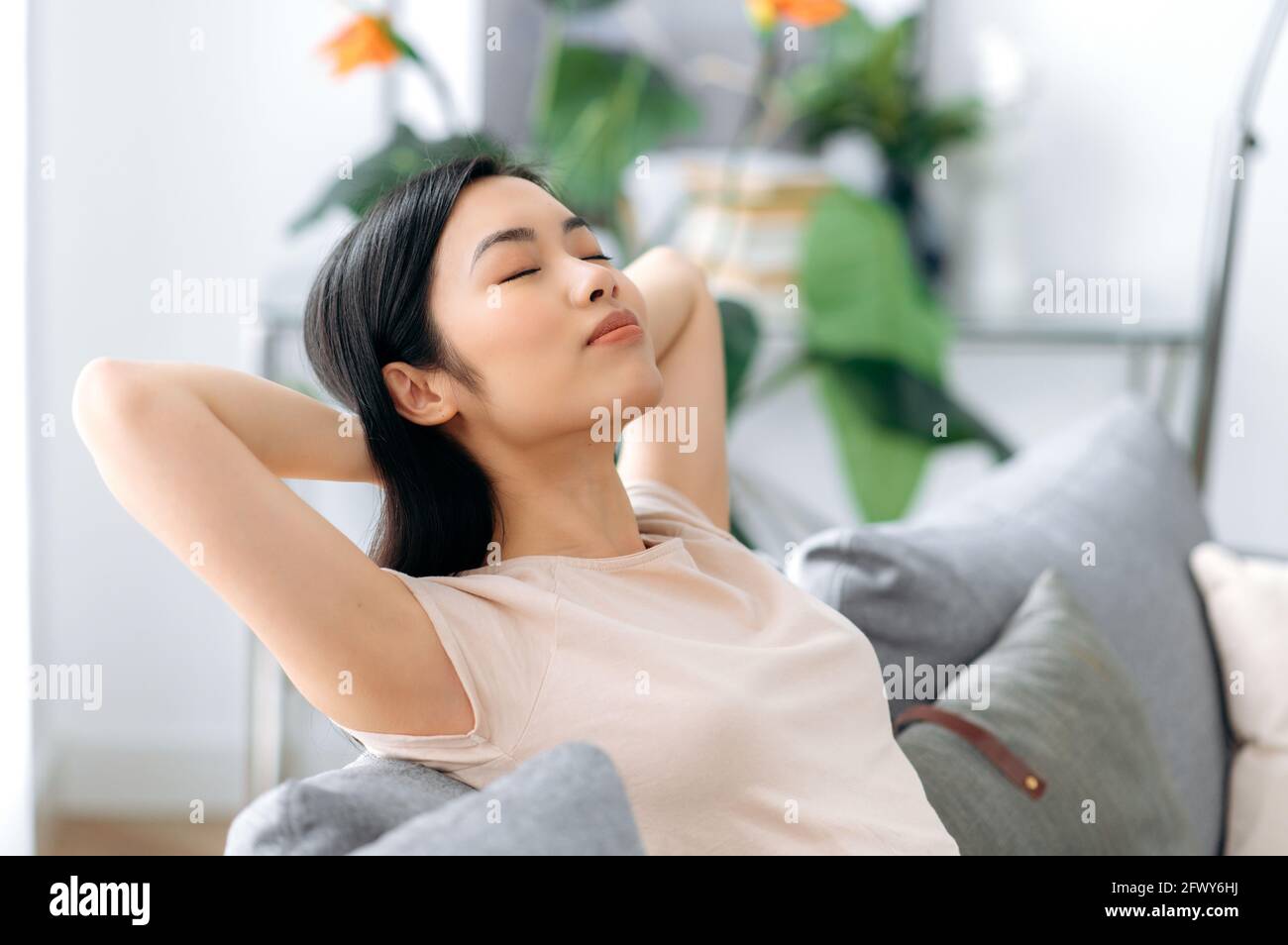 Woman relaxing sofa cosy hires stock photography and images Alamy
