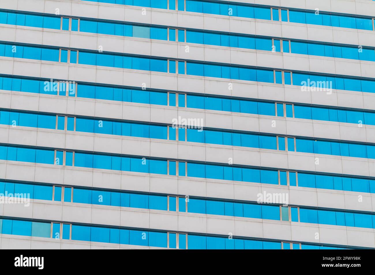 Blue glass wall of an office building background Stock Photo