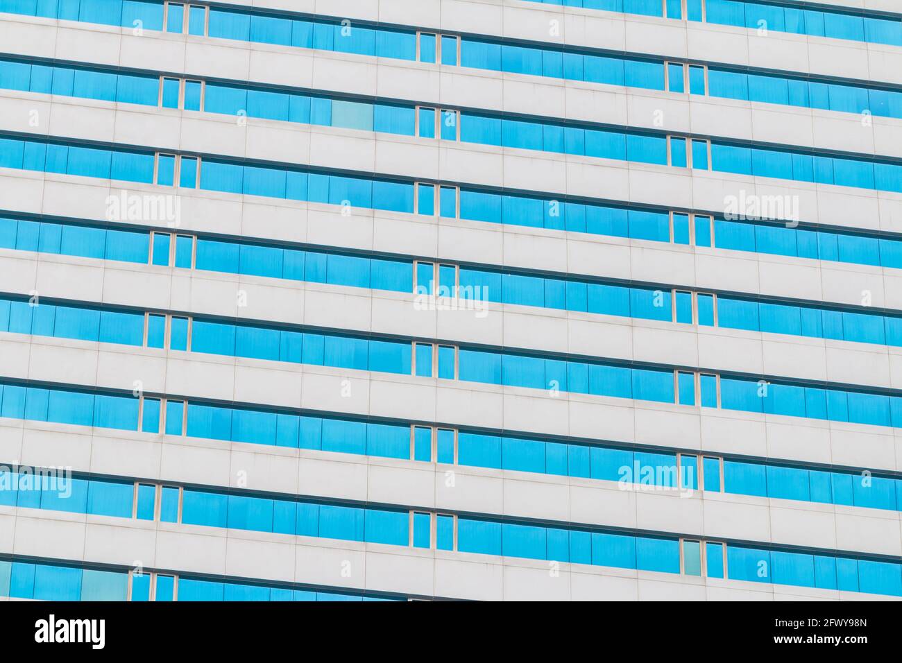 Blue glass wall of an office building background Stock Photo