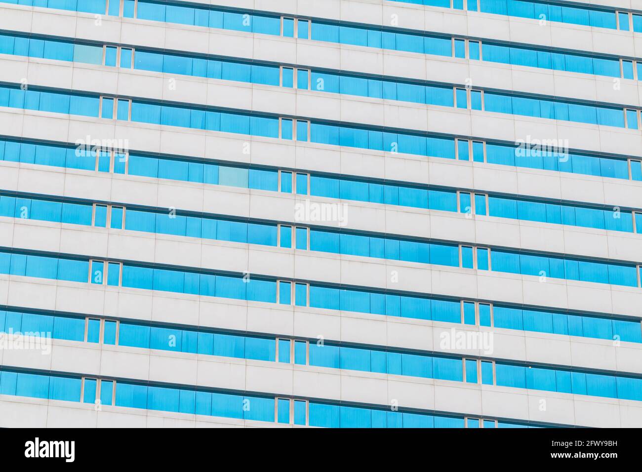 Blue glass wall of an office building background Stock Photo