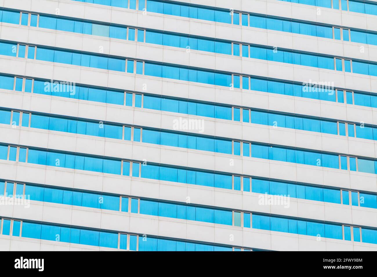 Blue glass wall of an office building background Stock Photo
