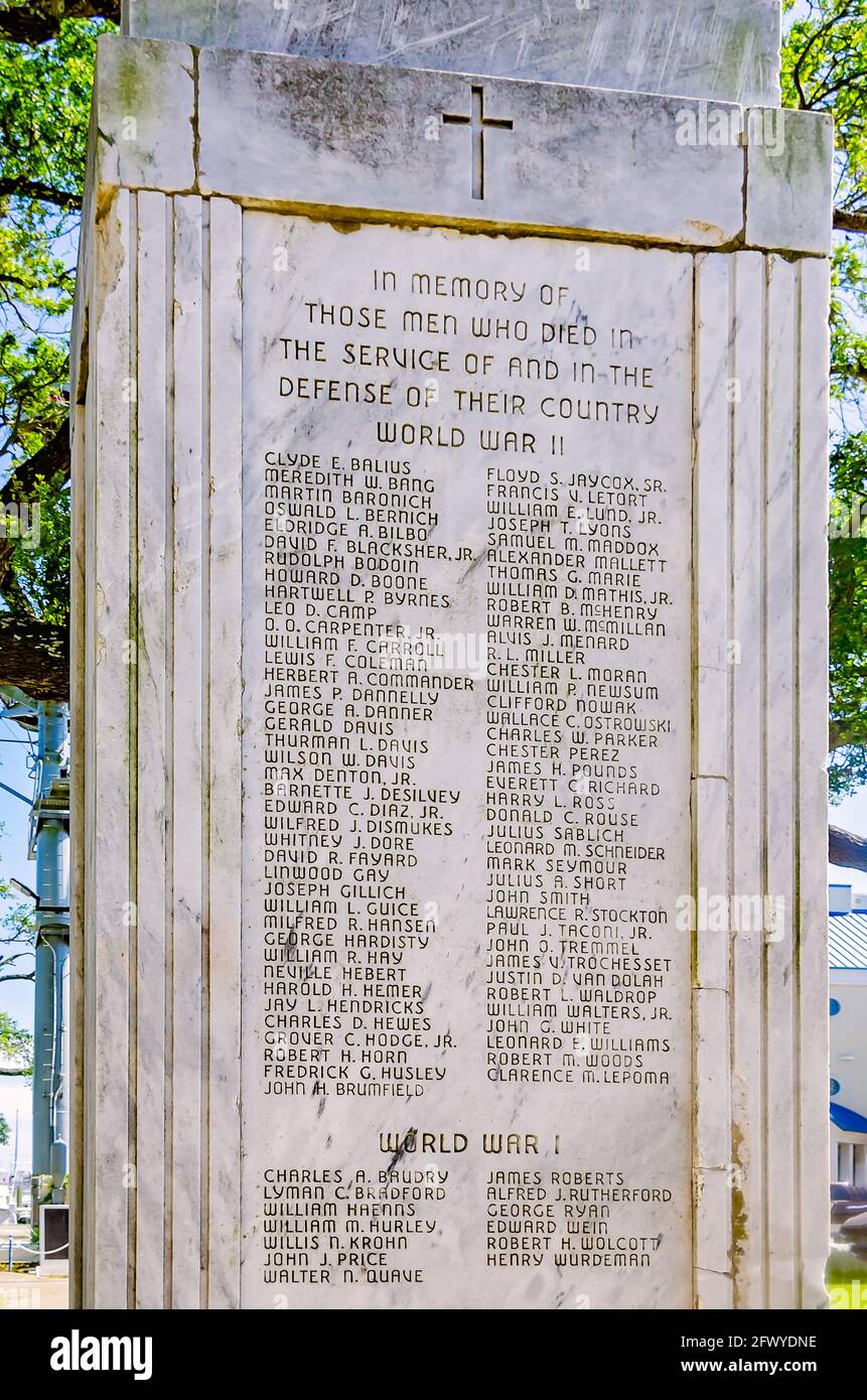 Headstones featuring photographs and inscriptions honor local veterans of World War I and World War II at Guice Park in Biloxi, Mississippi. Stock Photo