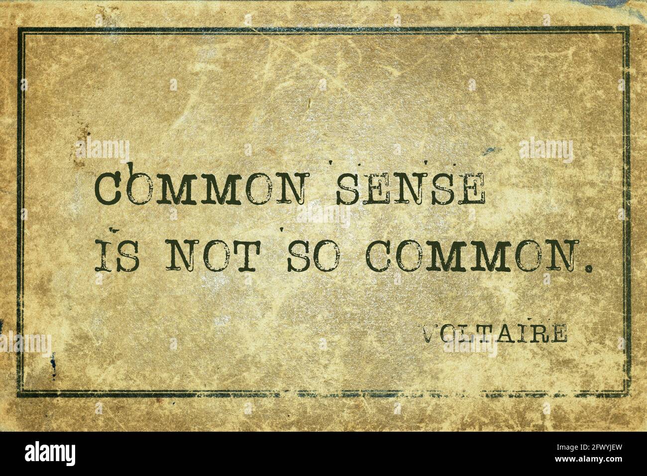 Common sense is not so common - ancient French philosopher and writer Voltaire quote printed on grunge vintage cardboard Stock Photo