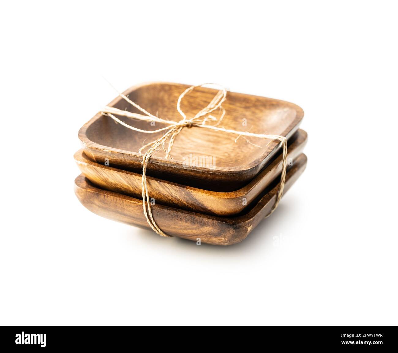 Three empty wooden bowl isolated on white background. Stock Photo
