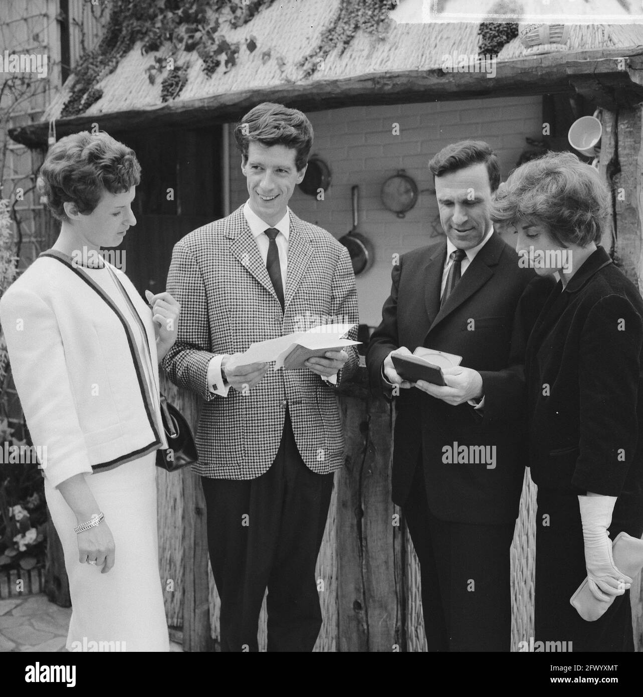 Rudi Carrell (left with wife) and Mr. H.A. Gomperts (right with wife) receive the award for outstanding achievements in the TV field, April 22, 1963, awards, The Netherlands, 20th century press agency photo, news to remember, documentary, historic photography 1945-1990, visual stories, human history of the Twentieth Century, capturing moments in time Stock Photo