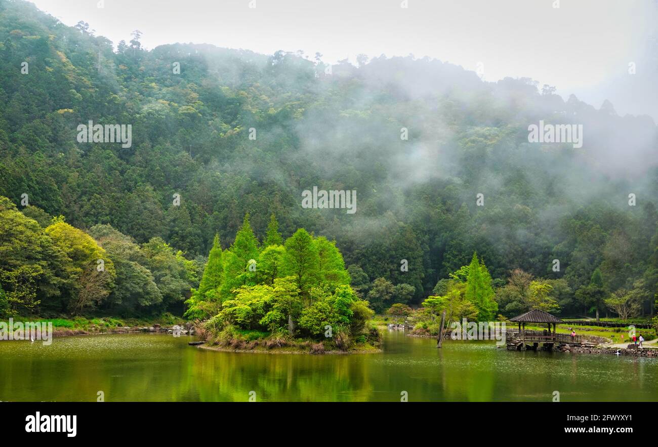 The clouds and mist surround the fairyland.The Mingchi is a high mountain lake with a cool and pleasant climate, located in Yilan County, Taiwan. Stock Photo