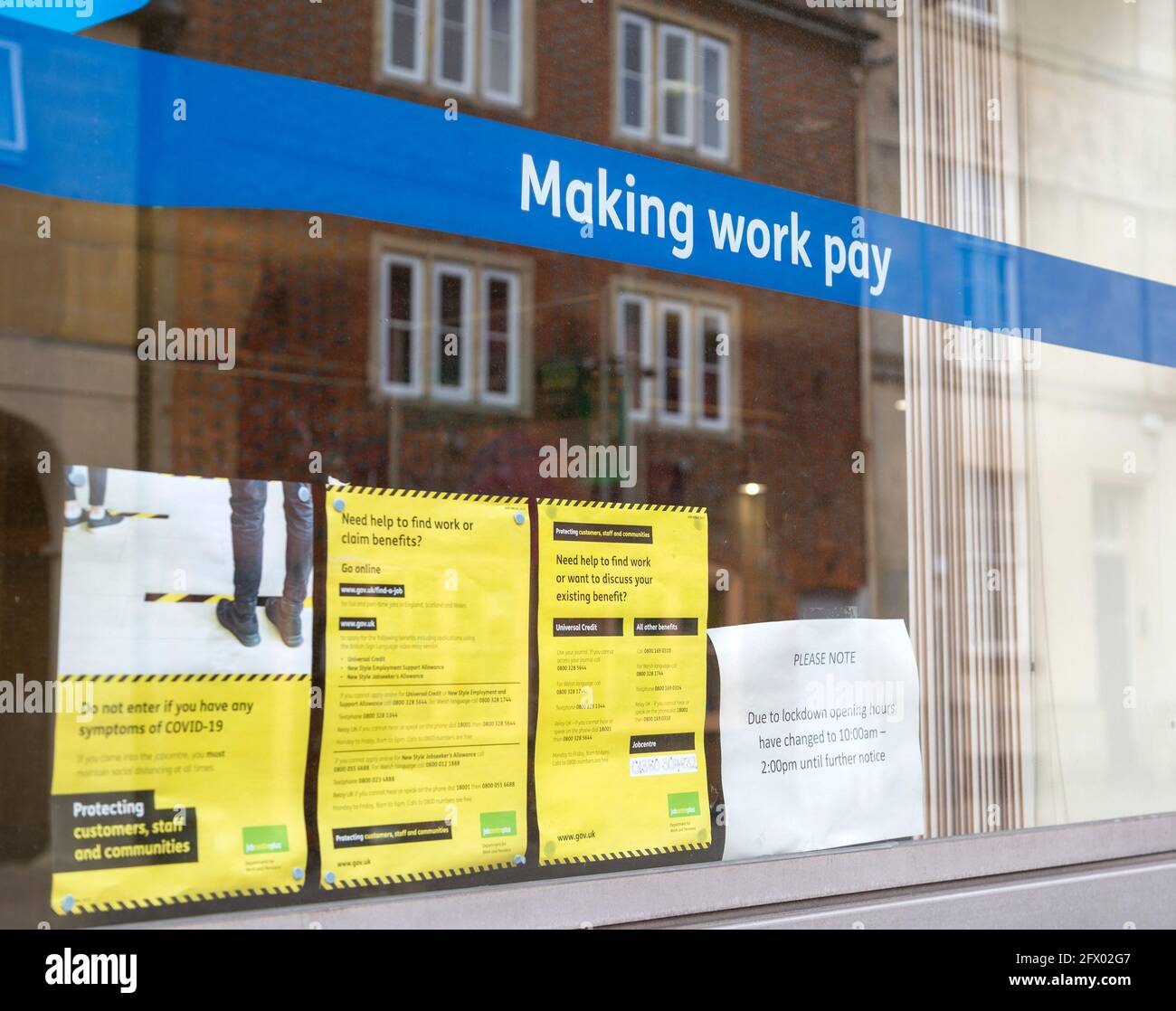 Making Work Pay banner message in window of Job centre, Devizes