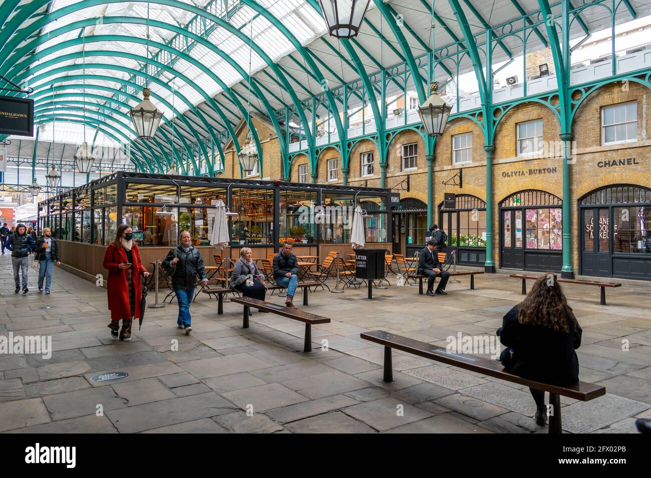 London. UK- 05.23.2021. Interior of the North Hall of Covent Garden Market with crowd of visitors and toursit returning as the economy reopens. Stock Photo