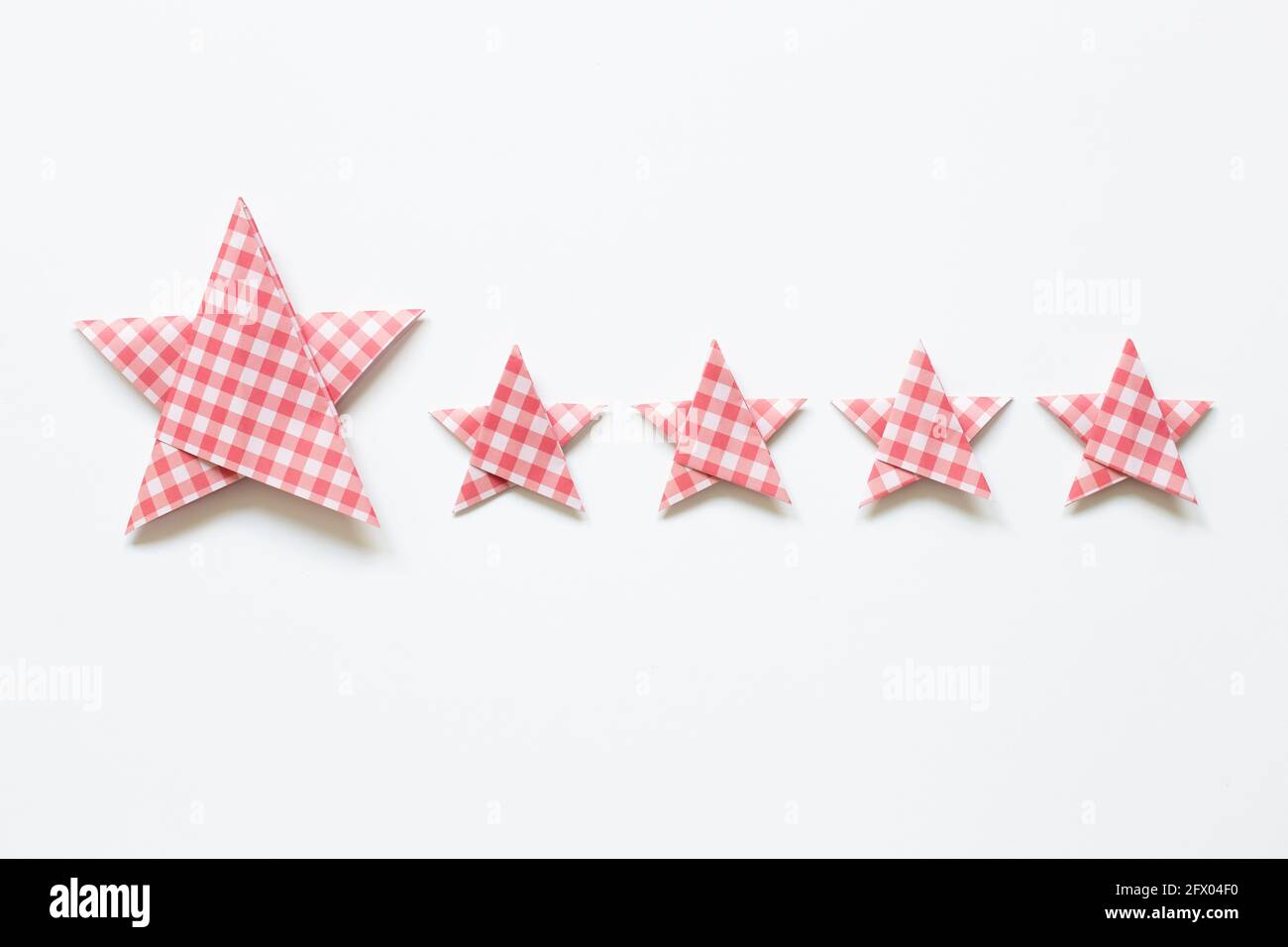 Red check pattern Five stars quality rating on white background. top ...