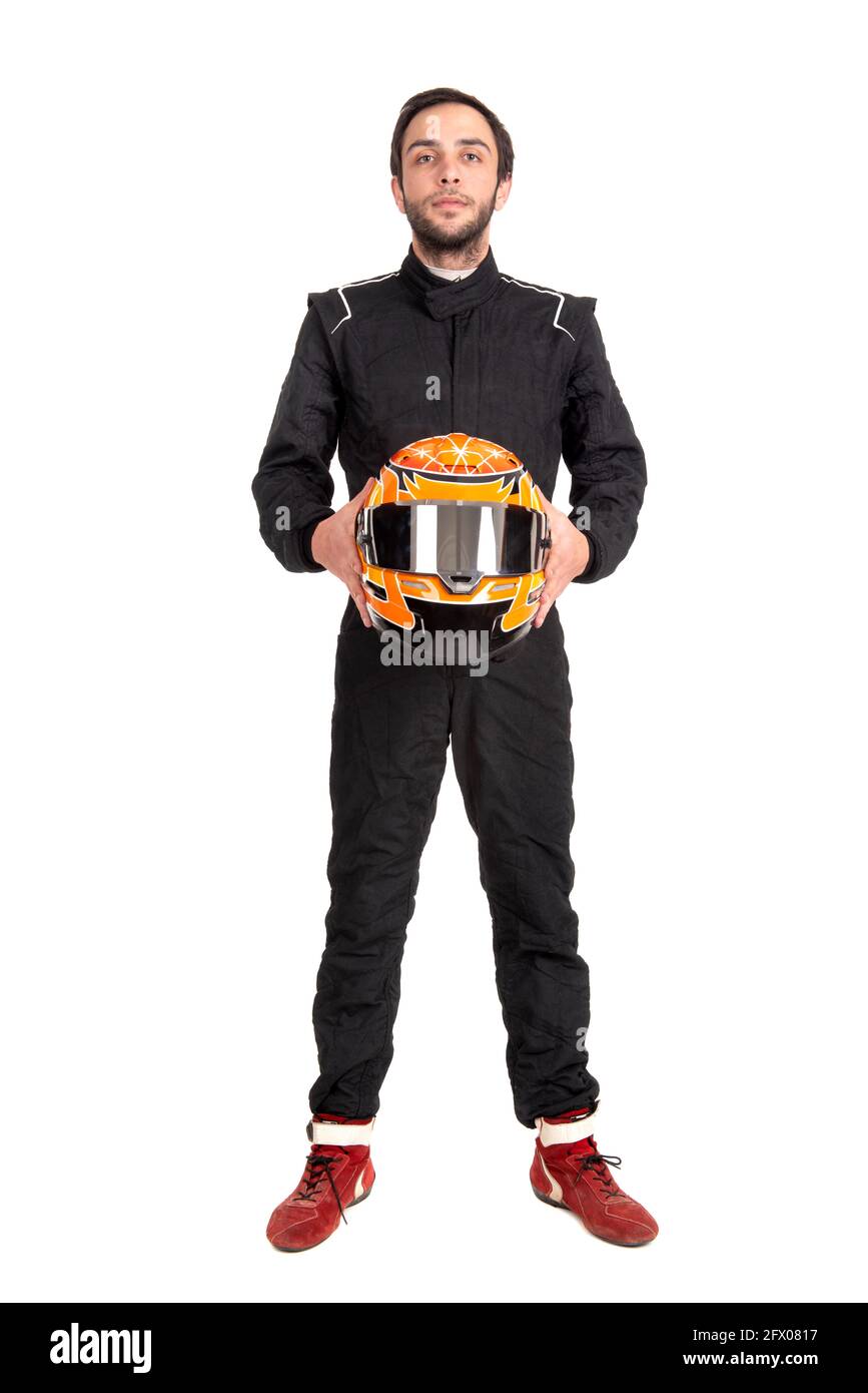 Racing driver in full gear posing isolated in a white background Stock Photo