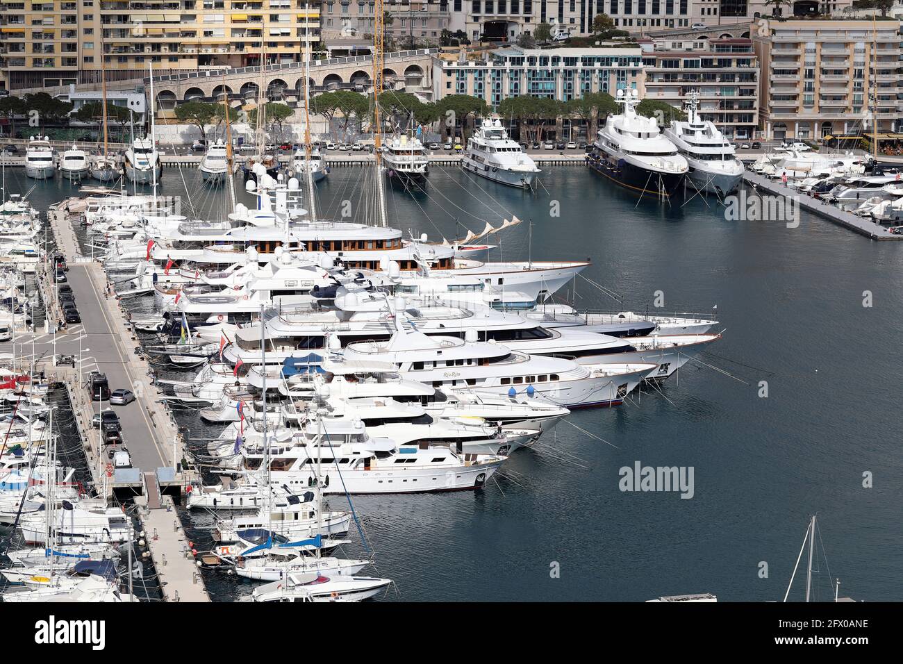 La Condamine, Monaco - February 20, 2021: Beautiful Luxury Yachts And Superyachts Are Lined Up In Port Hercule Monaco On The French Riviera, Europe, A Stock Photo