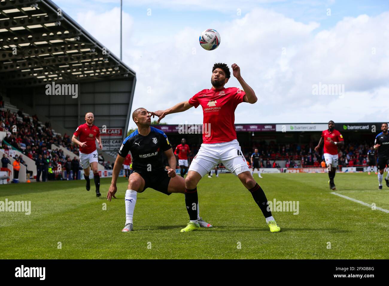 Morecambe's Nathaniel Knight-Percival and Tranmere Rovers' James Vaughn during the Sky Bet League Two semi final, second leg match at the Globe Stadium, Morecambe. Picture date: Sunday May 23, 2021. Stock Photo