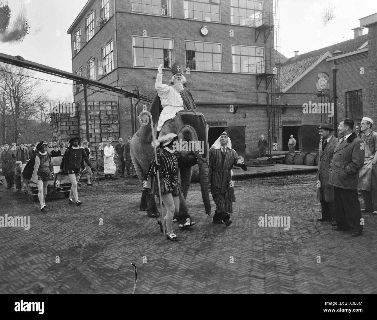 Saint Nicholas on elephant visiting Chemical Factory Naarden, December 1, 1954, OLIFANTS, The Netherlands, 20th century press agency photo, news to remember, documentary, historic photography 1945-1990, visual stories, human history of the Twentieth Century, capturing moments in time Stock Photo