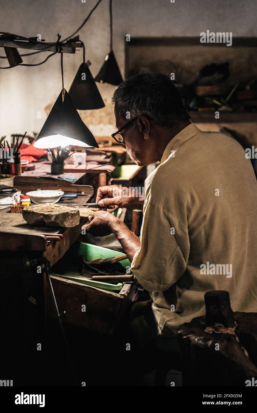 Side view ethnic craftsman hi-res stock photography and images - Alamy