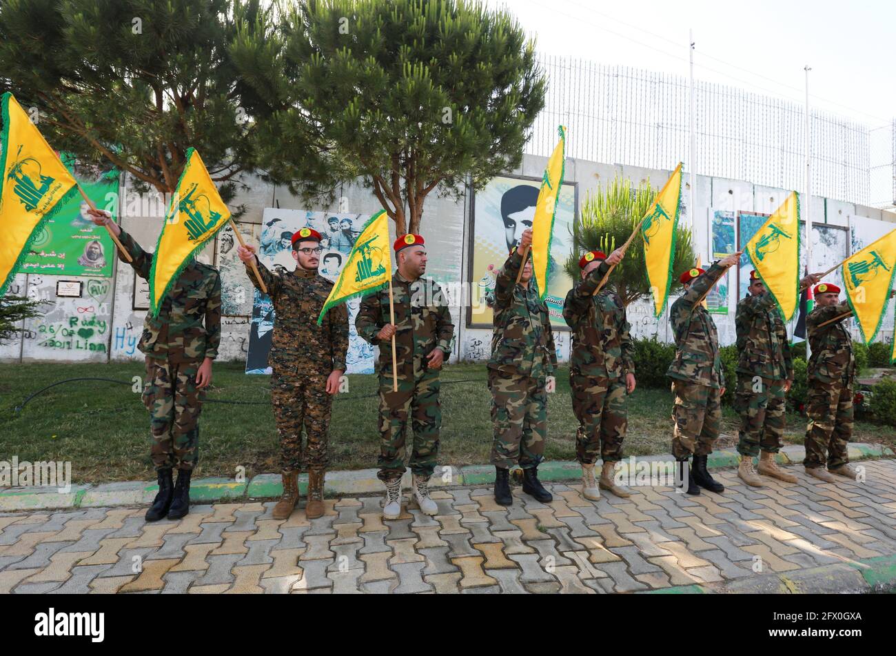 Hezbollah Members Hold Flags Marking Resistance And Liberation Day In Kfar Kila Near The Border With Israel Southern Lebanon May 25 2021 Reuters Aziz Taher Stock Photo Alamy