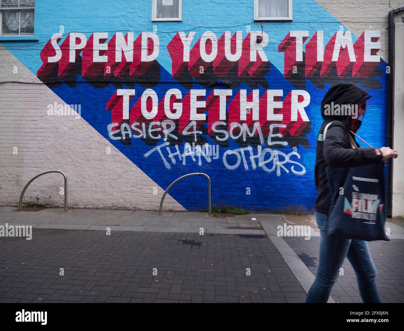 Graffiti Walthamstow High Street, London reading Spend your time together and easier for some than others Stock Photo