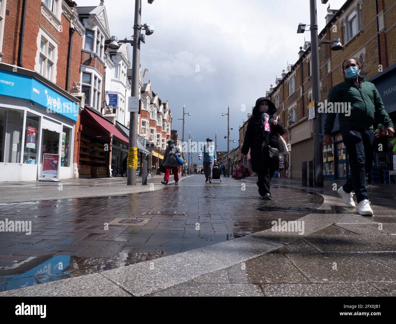 Walthamstow High Street, London with shoppers on quiet wet day Stock Photo