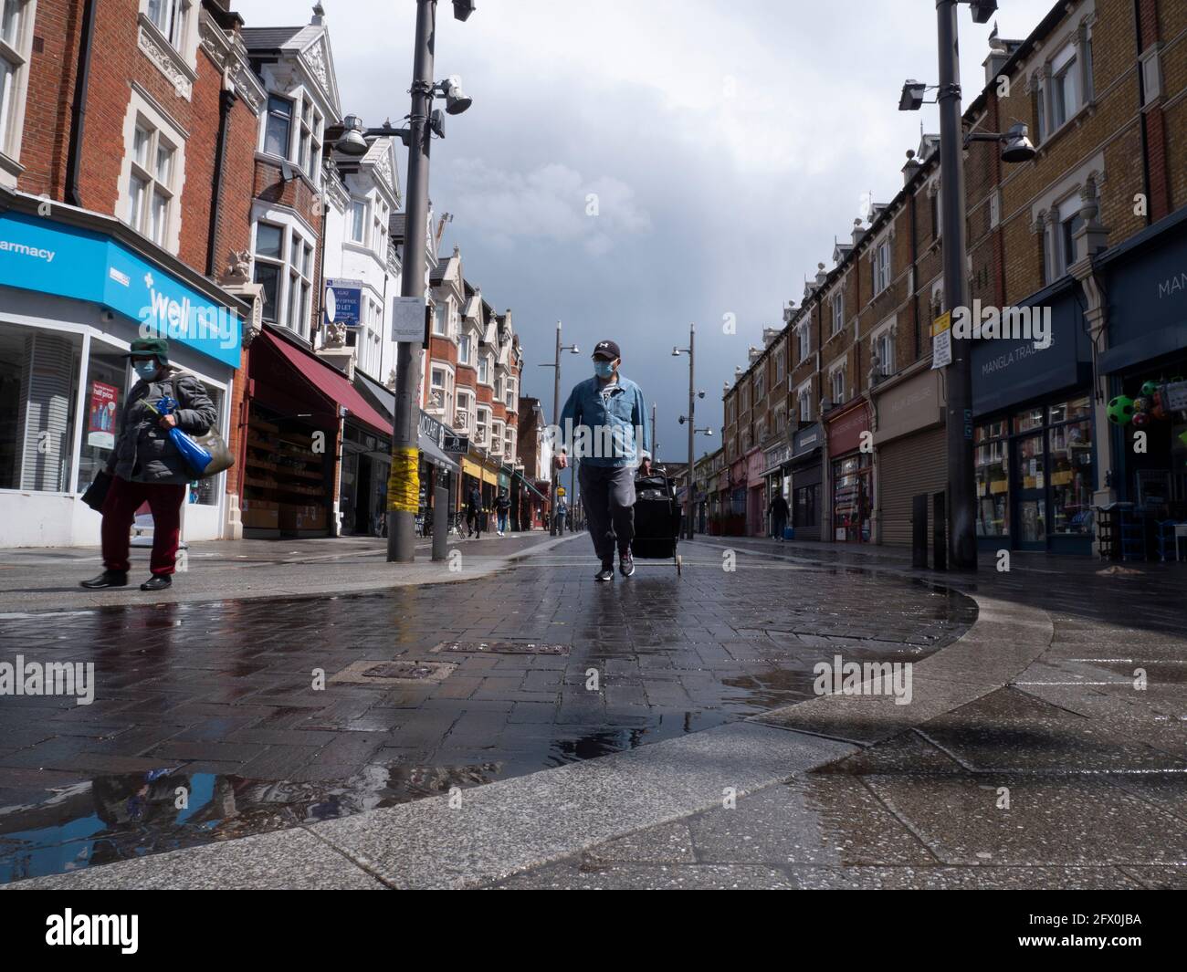 Walthamstow High Street, London with shoppers on quiet wet day Stock Photo