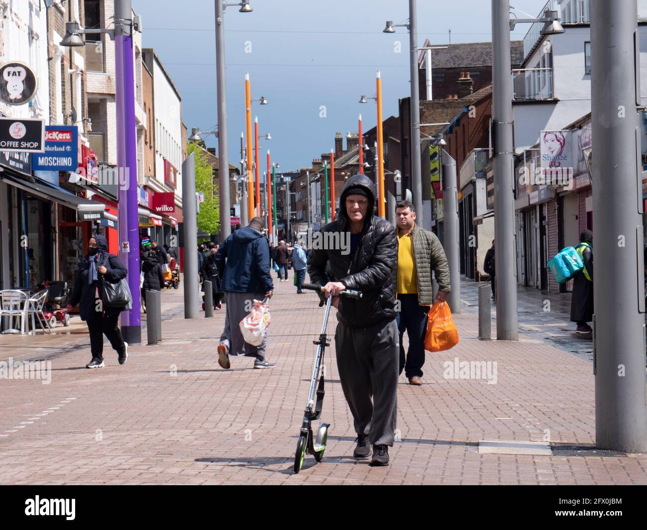 Walthamstow High Street, London, shopper  with scooter Stock Photo