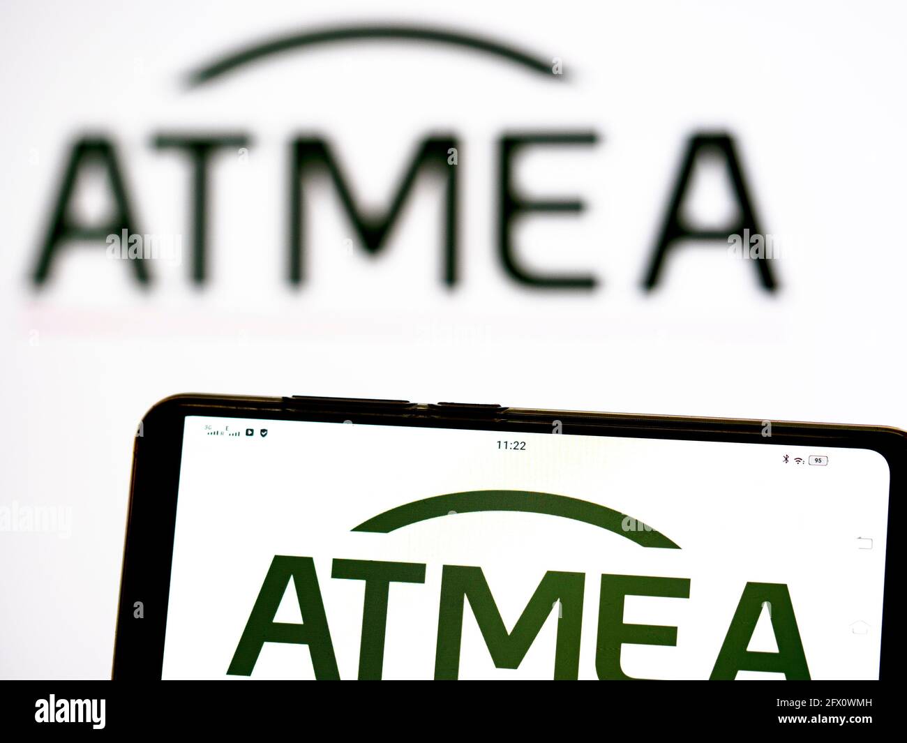 In this photo illustration Atmea logo seen displayed on a smartphone. This company founded by Mitsubishi Heavy Industries and EDF Group Stock Photo