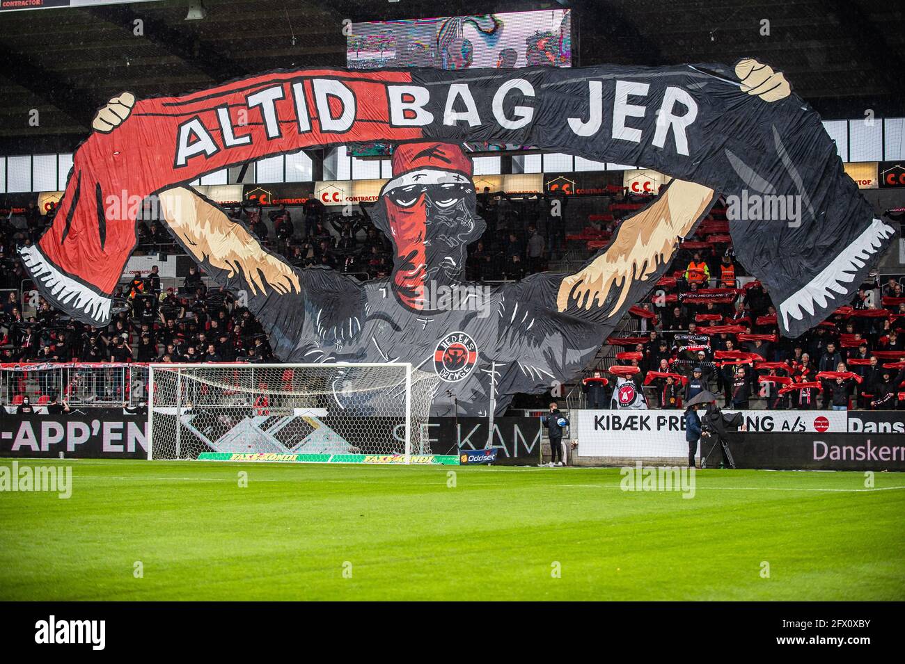 Herning, Denmark. 24th May, 2021. Football fans of FC Midtjylland seen in the stands with a huge tifo before the 3F Superliga match between FC Midtjylland and Aarhus GF at MCH Arena in Herning. (Photo Credit: Gonzales Photo/Alamy Live News Stock Photo