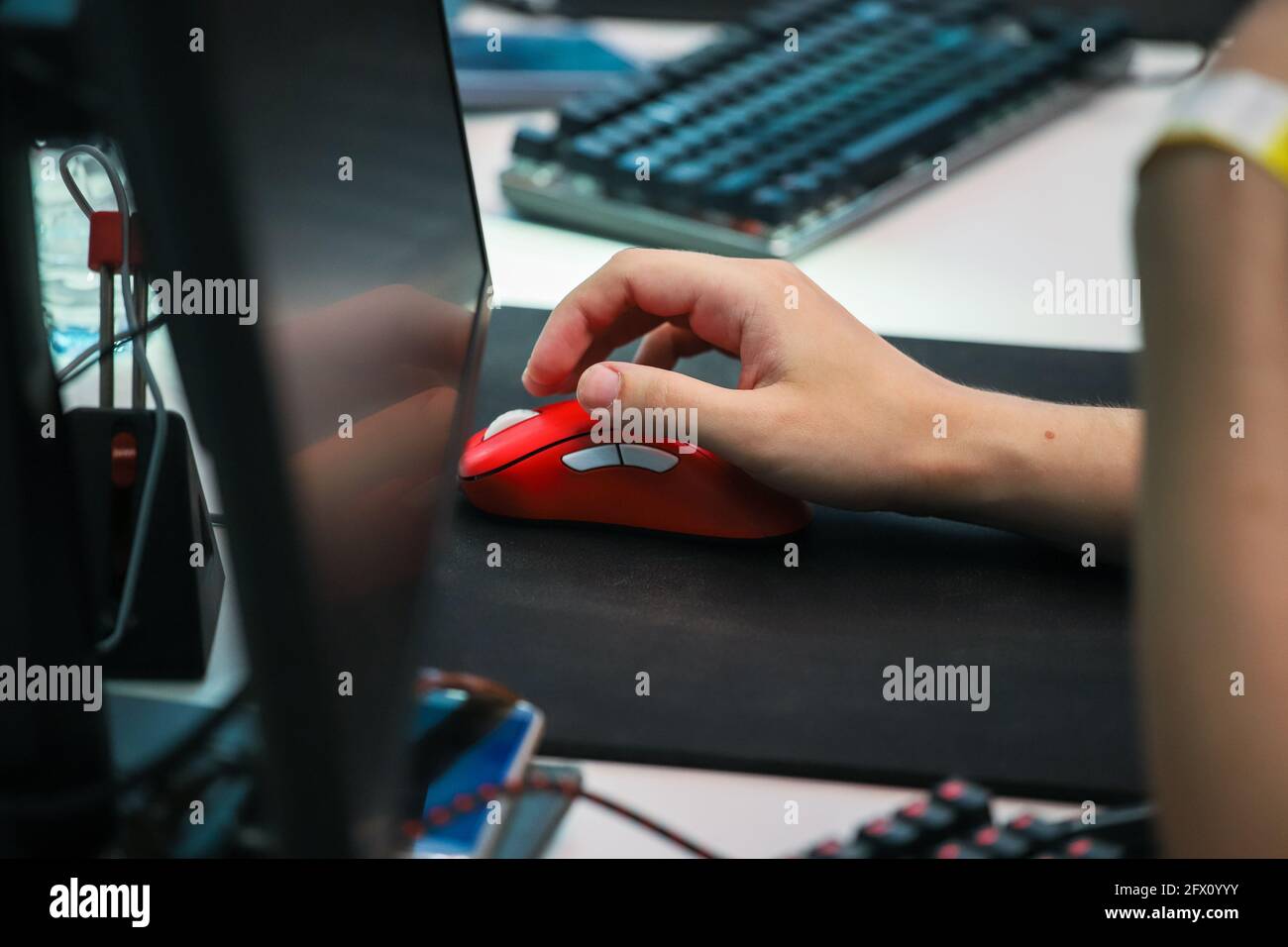 Cyber sport gamer click mouse. Hand on a mouse. PC monitor, keyboard. High  quality photo Stock Photo - Alamy