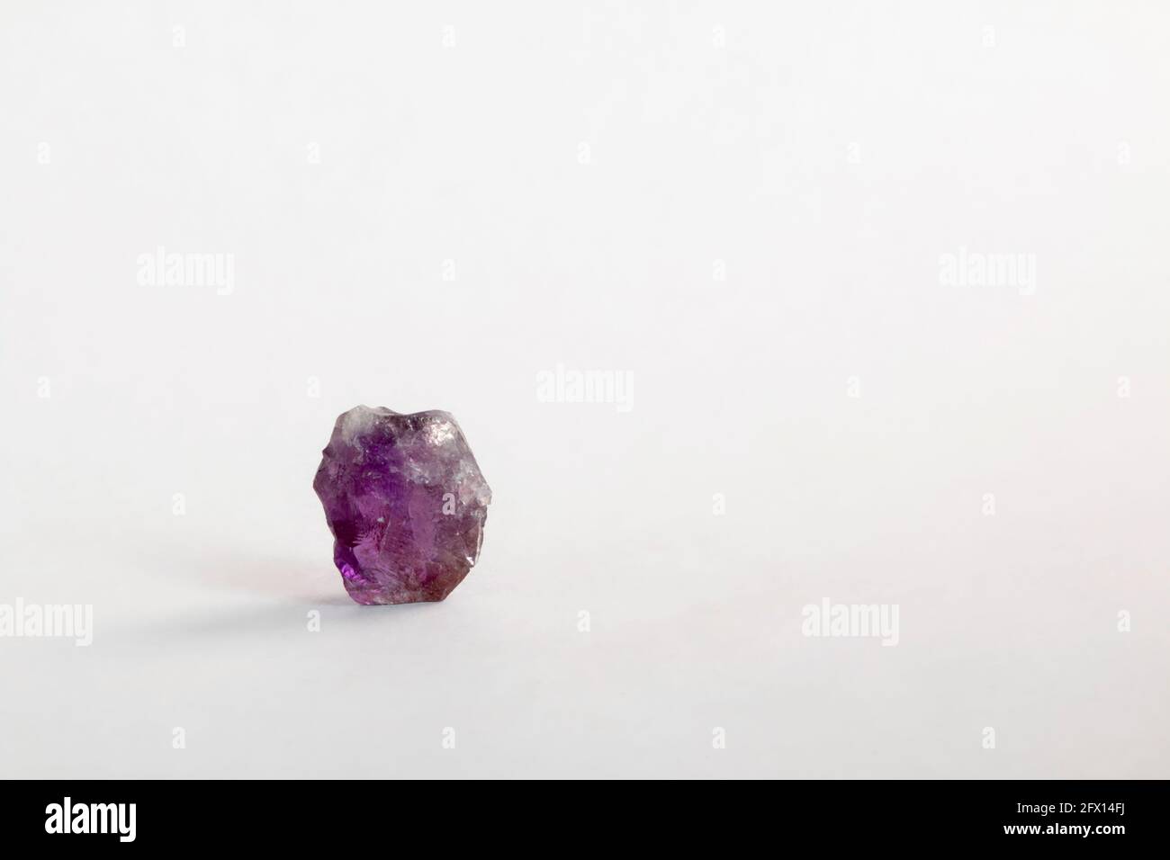Speicimen of the mineral Amethyst on a white background Stock Photo - Alamy