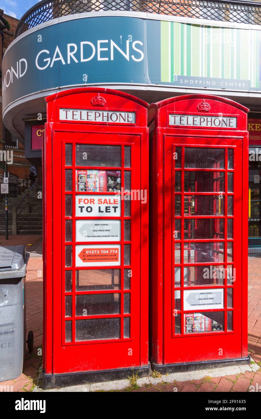 Bournemouth, Dorset, UK. 25th May, 2021. Two iconic red telephone boxes in Bournemouth Town Centre are up for sale and being auctioned off tomorrow, 26th May, with a starting price of £19,000. Known as 'K6' red phone boxes or 'Jubilee' kiosks, they were designed by Sir Giles Gilbert Scott and introduced to commemorate the Silver Jubilee of the coronation of King George V in 1935. They are constructed of cast-iron sections, bolted together, standing on a concrete base and are 8'3' high and three feet square. Credit: Carolyn Jenkins/Alamy Live News Stock Photo