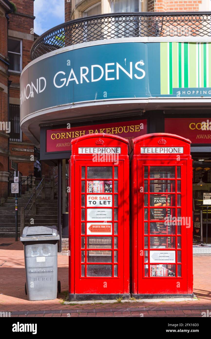 Bournemouth, Dorset, UK. 25th May, 2021. Two iconic red telephone boxes in Bournemouth Town Centre are up for sale and being auctioned off tomorrow, 26th May, with a starting price of £19,000. Known as 'K6' red phone boxes or 'Jubilee' kiosks, they were designed by Sir Giles Gilbert Scott and introduced to commemorate the Silver Jubilee of the coronation of King George V in 1935. They are constructed of cast-iron sections, bolted together, standing on a concrete base and are 8'3' high and three feet square. Credit: Carolyn Jenkins/Alamy Live News Stock Photo