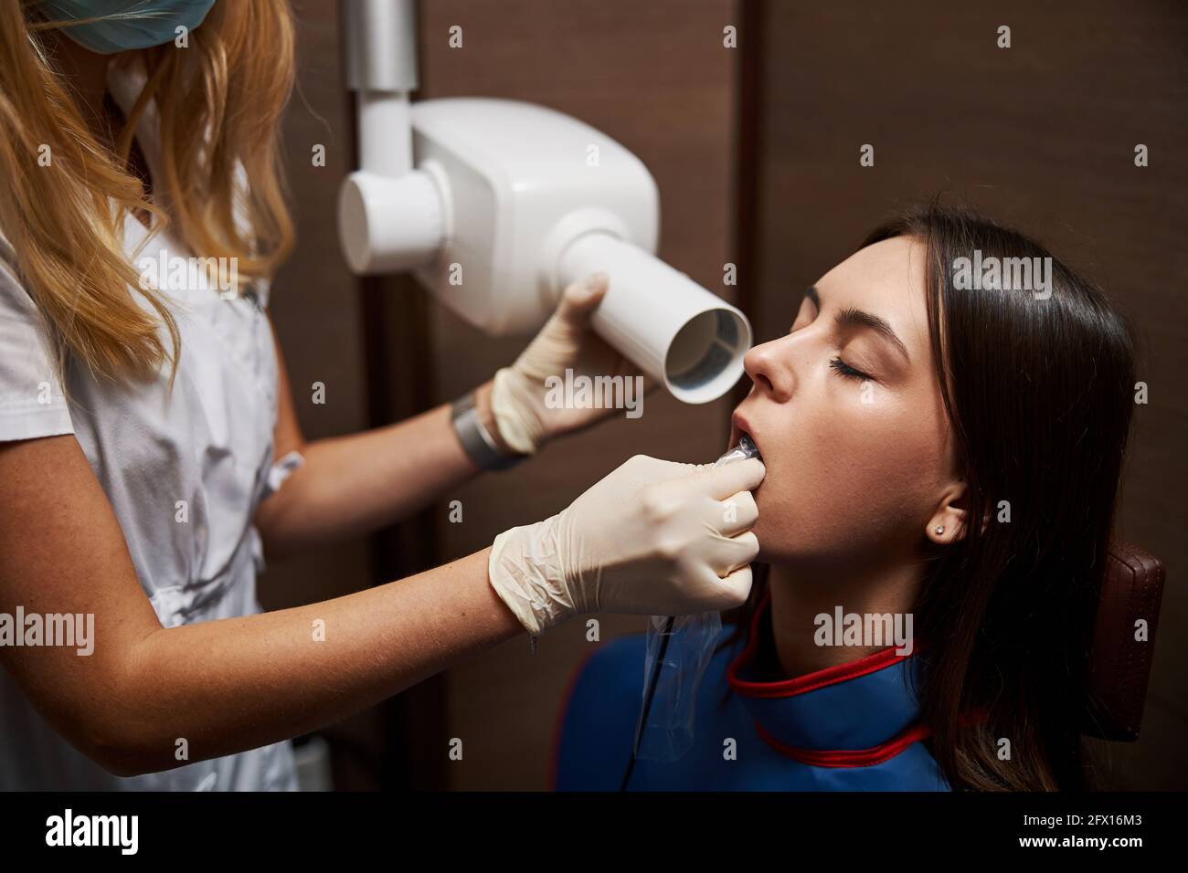 Relaxed female is undergoing dental xray examination Stock Photo Alamy
