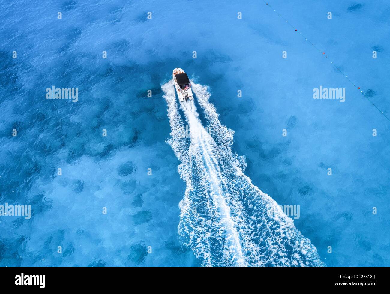 Aerial view of the boat in clear blue water at sunny day Stock Photo ...