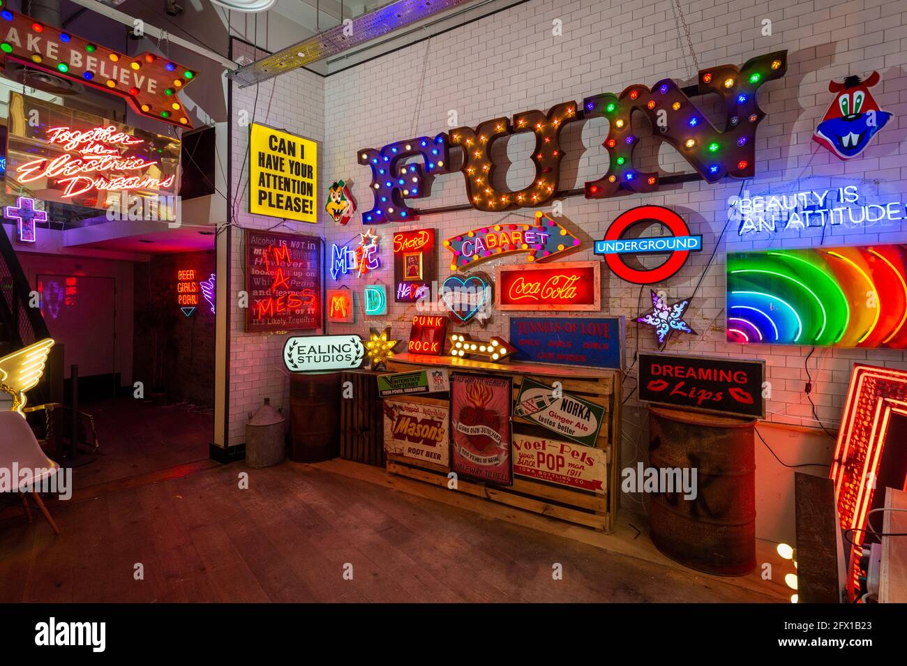 London, UK.  25 May 2021.  Preview of “Electric City” an exhibition in Leadenhall Market of neon and set pieces made for film by Gods Own Junkyard, which has worked on film sets for over 40 years. Founder, Chris Bracey passed away in 2014 and the business has since been run by his wife Linda and sons Matthew and Marcus, all neon makers and designers. On show 26th May to 31st July is neon signage from Stanley Kubrick’s Eyes Wide Shut, Judge Dredd, Batman, Tomb Raider, Charlie and the Chocolate Factory and The Dark Knight.  Credit: Stephen Chung / Alamy Live News Stock Photo