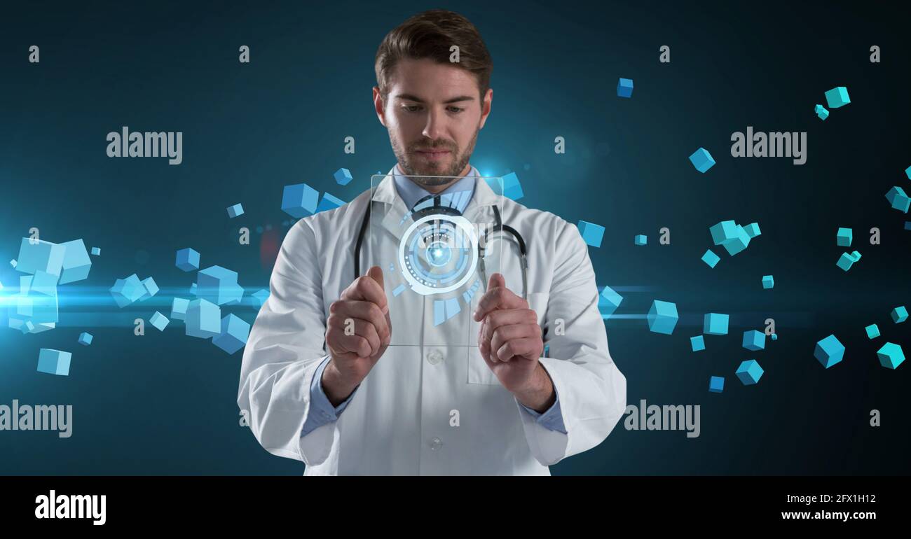 Composition of male doctor holding interactive screen with medical data ...