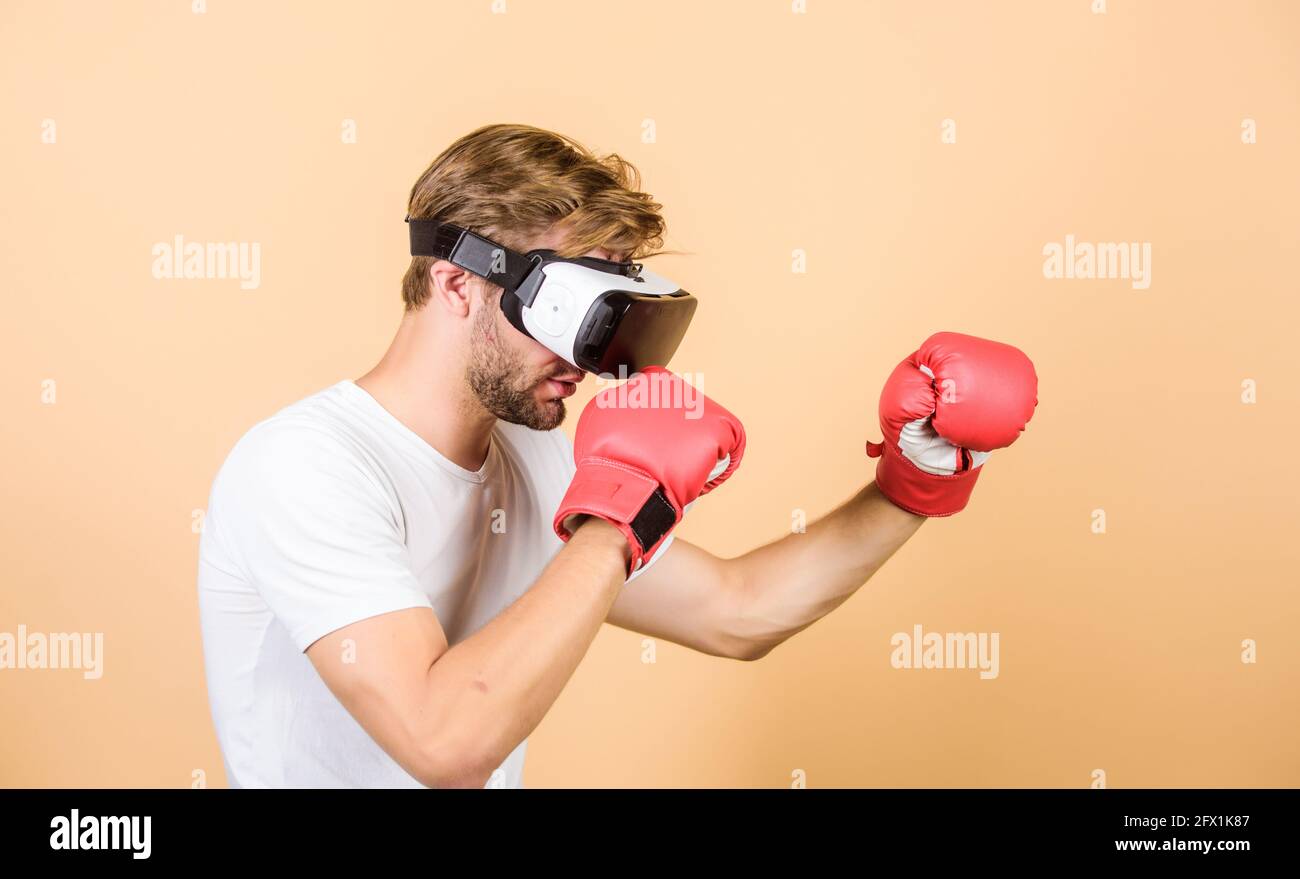Augmented 3D world. Man boxer virtual reality headset simulation. Man play  game in VR glasses. Cyber sport concept. Cyber coach online training Stock  Photo - Alamy