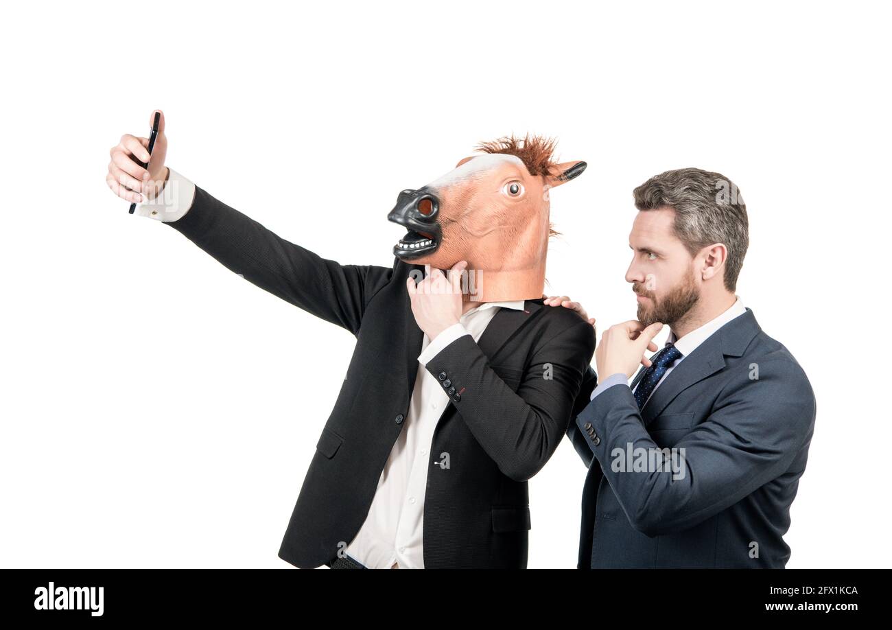 Live streaming with your phone. Employees take selfie with smartphone. Mobile live streaming Stock Photo