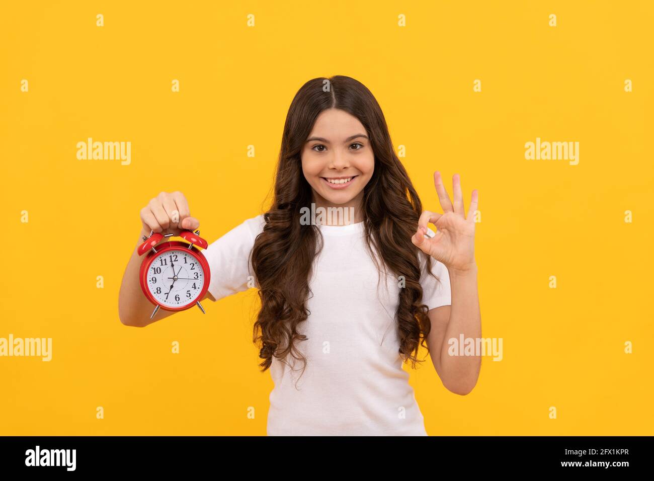 punctuality. happy kid hold alarm clock. last chance. time for shopping sales. good morning. Stock Photo