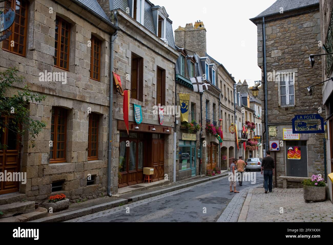 Rue du Temple, Moncontour, Côtes d'Armor, Brittany, France: entry to the main square.  MODEL RELEASED Stock Photo