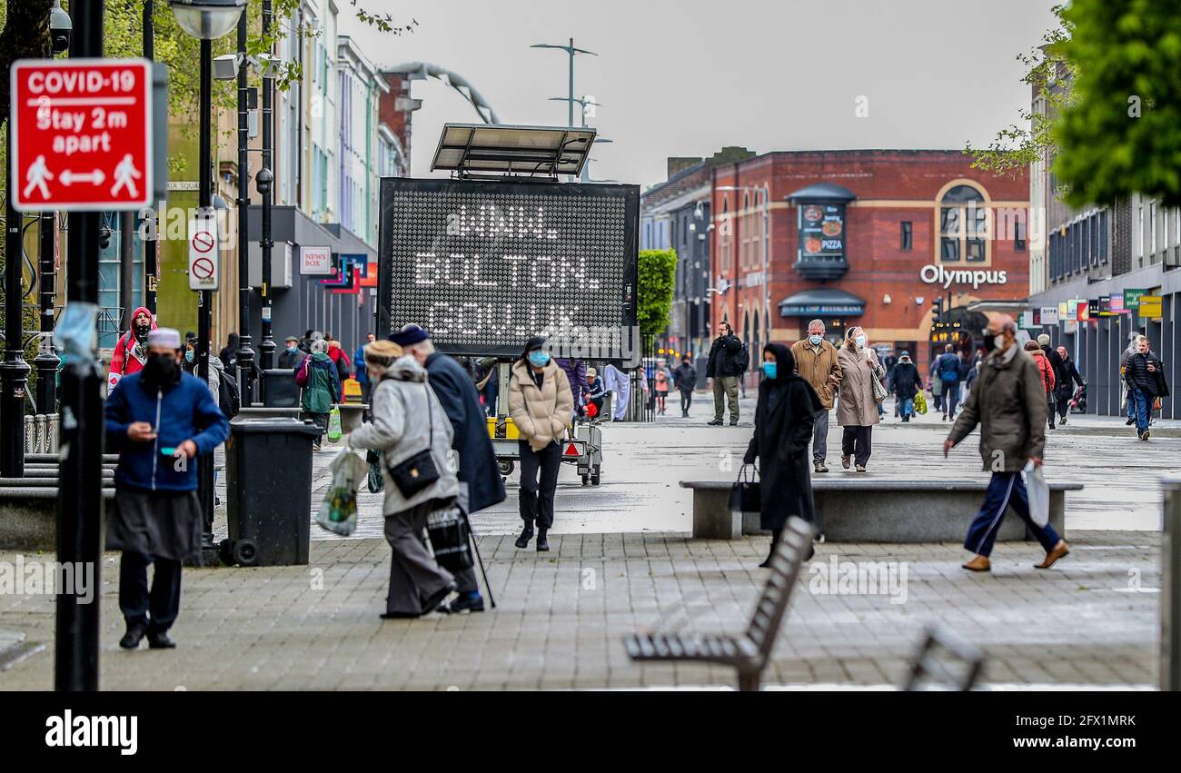 An electronic notice board in Bolton town centre, one of the areas of the UK where the Covid variant first identified in India is spreading fastest. Picture date: Tuesday May 25, 2021. Stock Photo