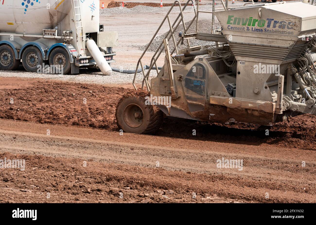Machine laying ground stabilization material Stock Photo Alamy
