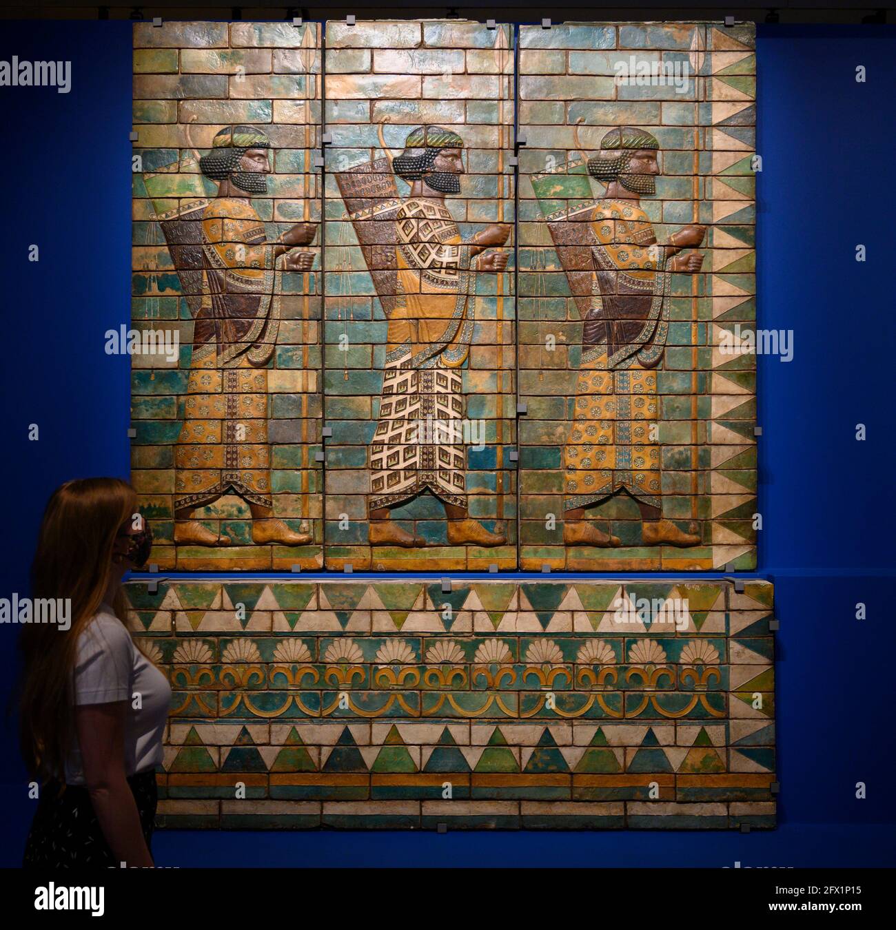 V&A, London UK. 25 May 2021. Epic Iran exhibition explores 5,000 years of art, design and culture through its journey into the 21st century. The exhibition runs from 29 May-12 September 2021. Image: The King’s Bodyguard, 522-486 BC. Copies of glazed panels made in 1889 to 1891. The originals were found in the Palace of Darius at Susa. Processional Guard in Persian costume. V&A Repro. Credit: Malcolm Park/Alamy Live News. Stock Photo