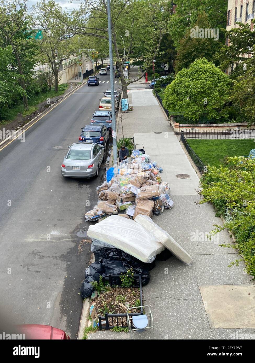 Garbage on the curb ready for pickup on a residential street in the Windsor Terrace neighborhood of Brooklyn, New Yortk. Stock Photo