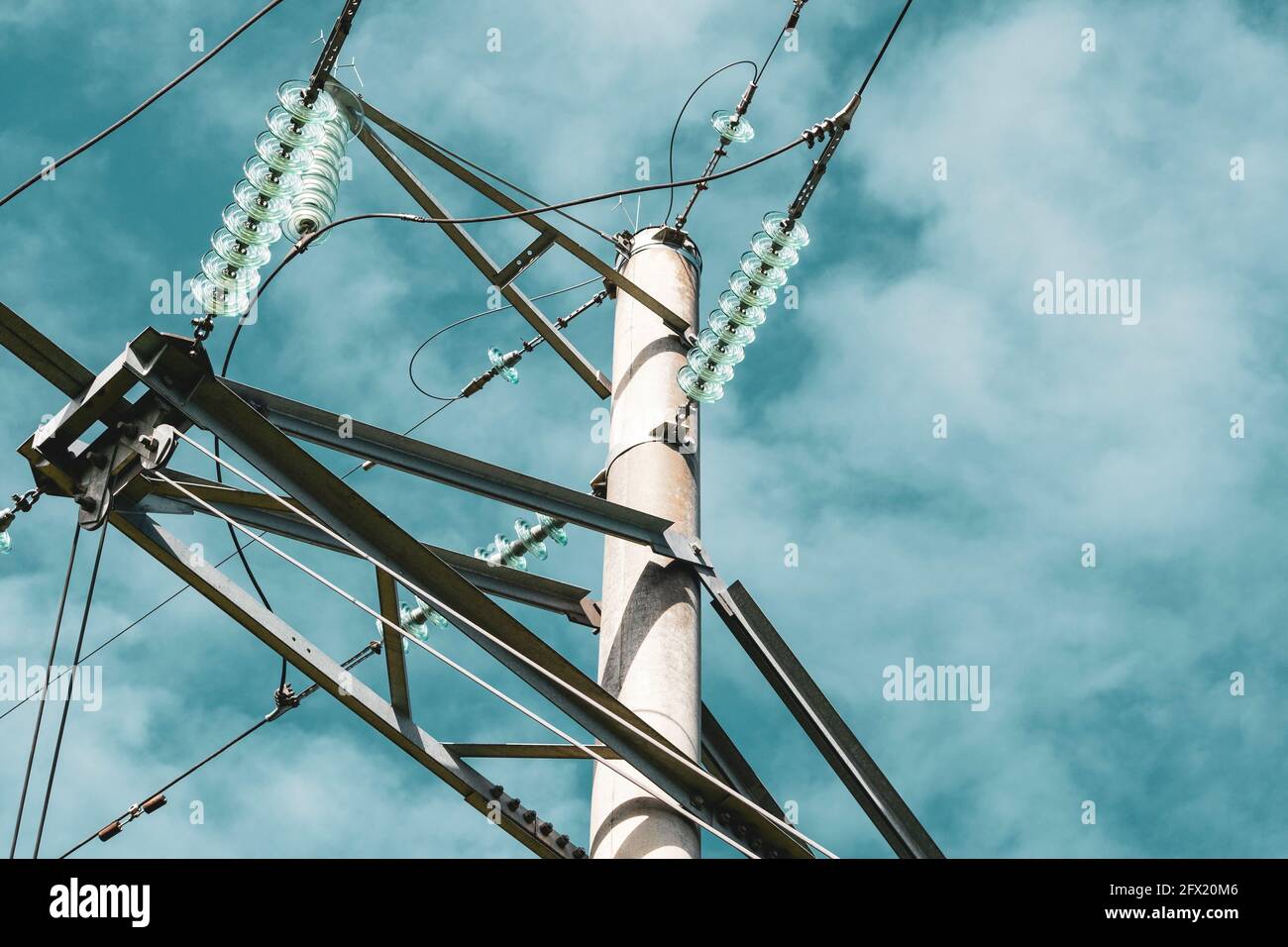 Close-up of high voltage tower with electricity transmission power ...