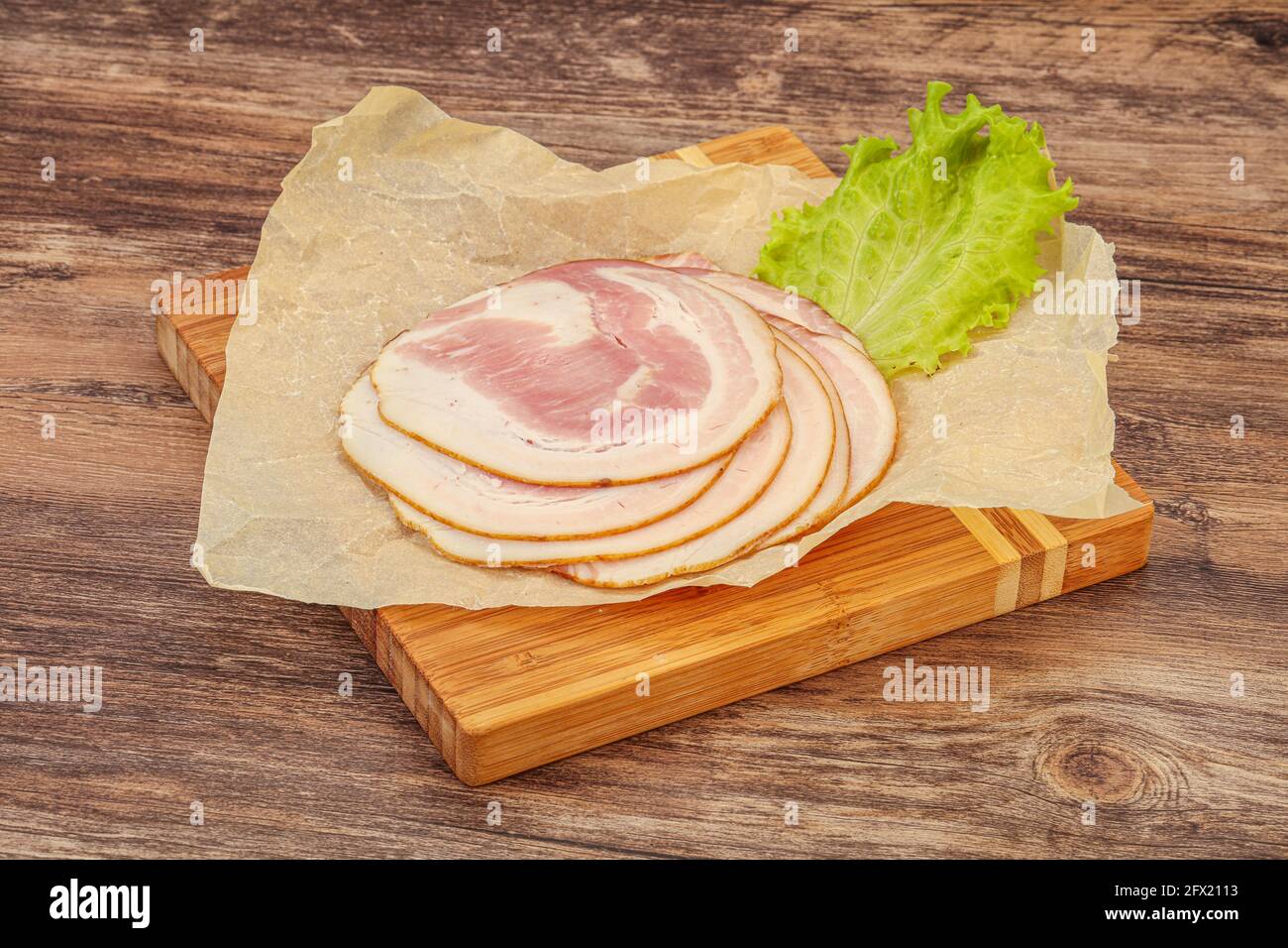 Sliced Italian Pancetta sausage over board Stock Photo Alamy