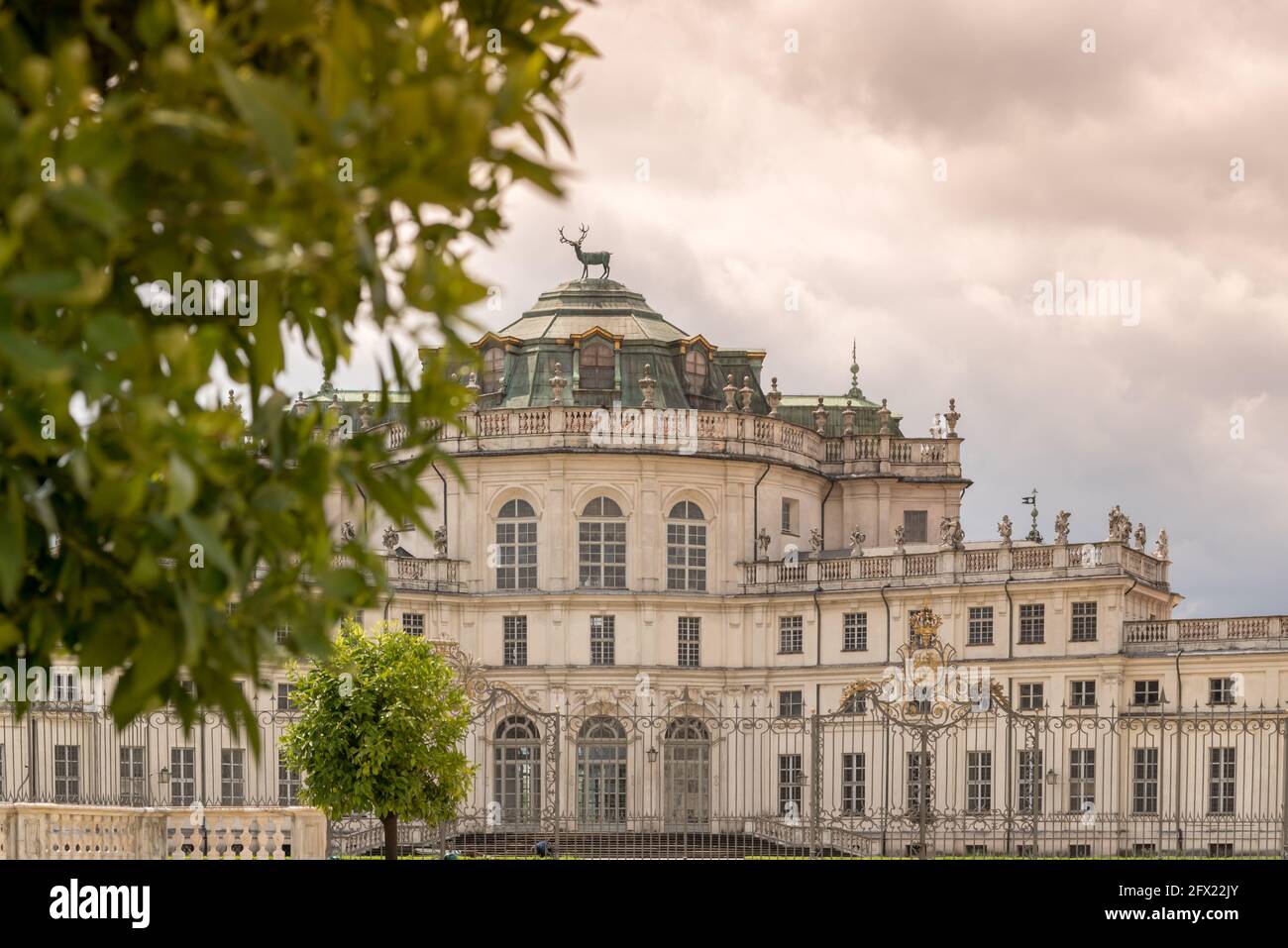 Stupinigi, Turin, Italy: historic royal hunting lodge of the Savoy royal house, selective focus blurred leaves in the foreground Stock Photo