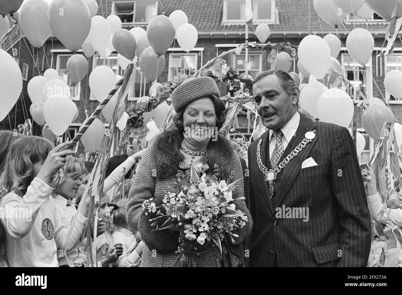 Princess Beatrix opens new town hall of Ridderkerk; Princess Beatrix walks with mayor Verplanke through hedge formed by children, March 11, 1980, Children, mayors, town halls, openings, The Netherlands, 20th century press agency photo, news to remember, documentary, historic photography 1945-1990, visual stories, human history of the Twentieth Century, capturing moments in time Stock Photo