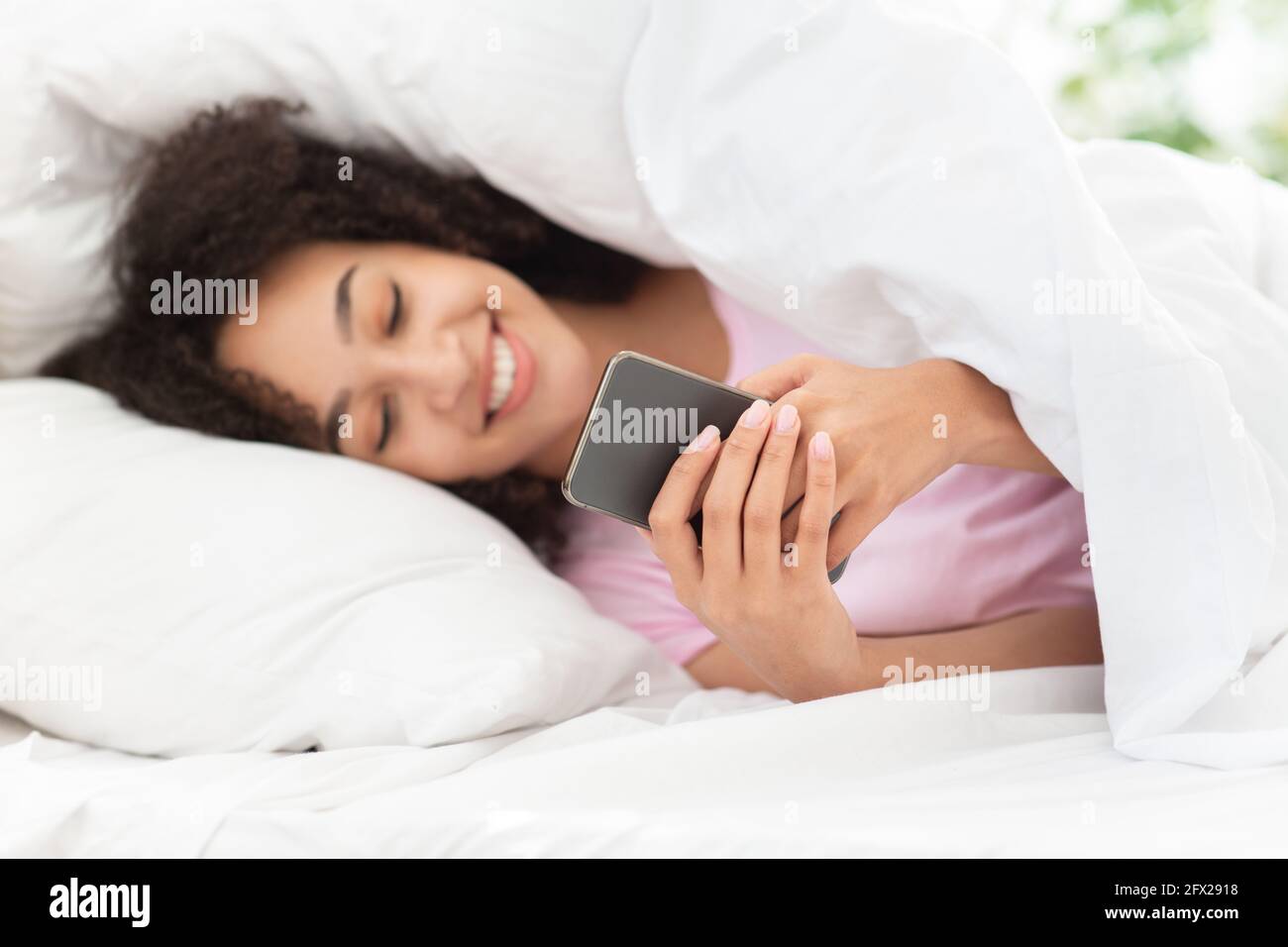 Happy emotions, good message and ad, mobile app and relax at home Stock Photo