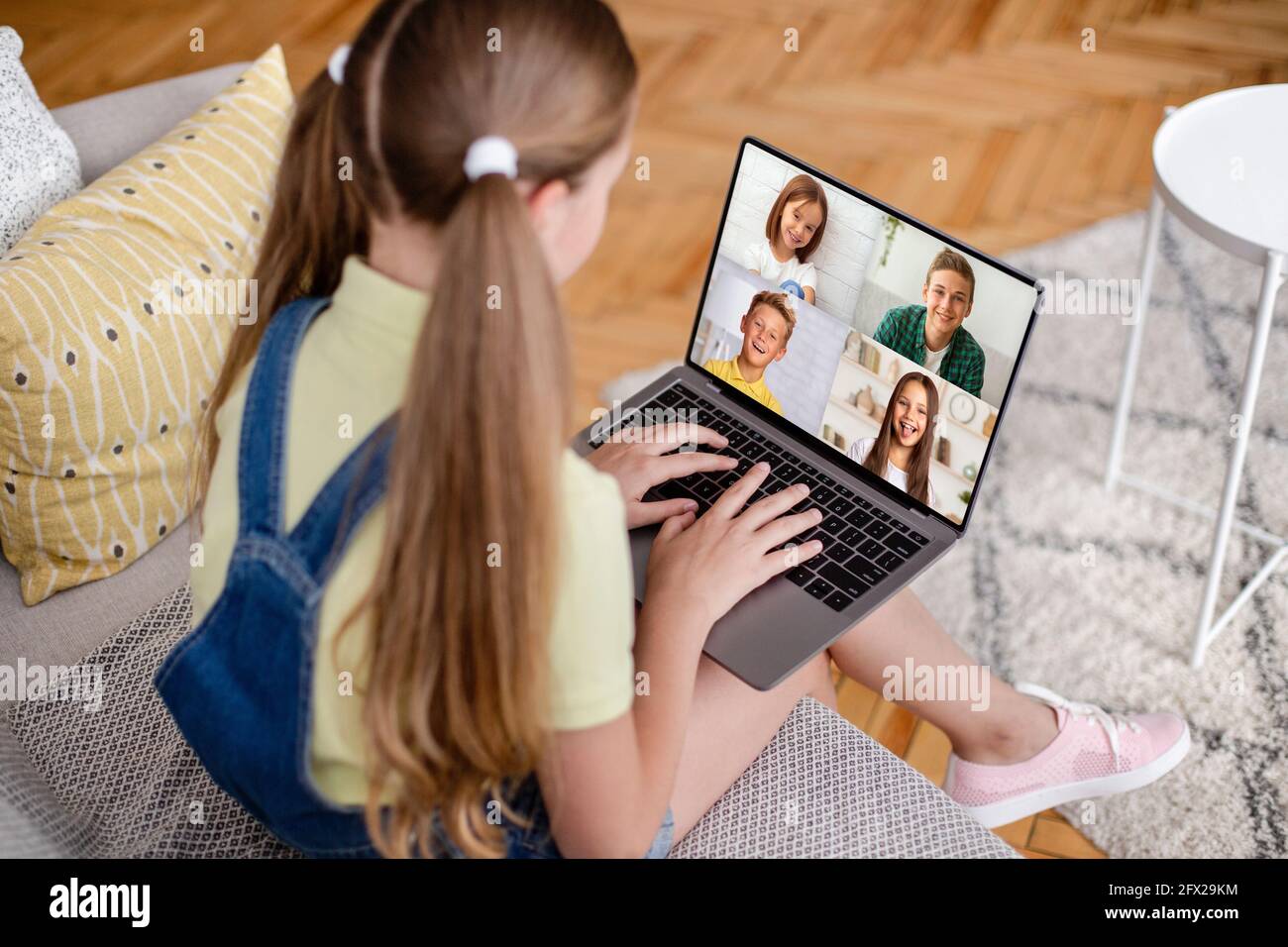 Covid-19 quarantine and social distance, online class and chat of little friends Stock Photo
