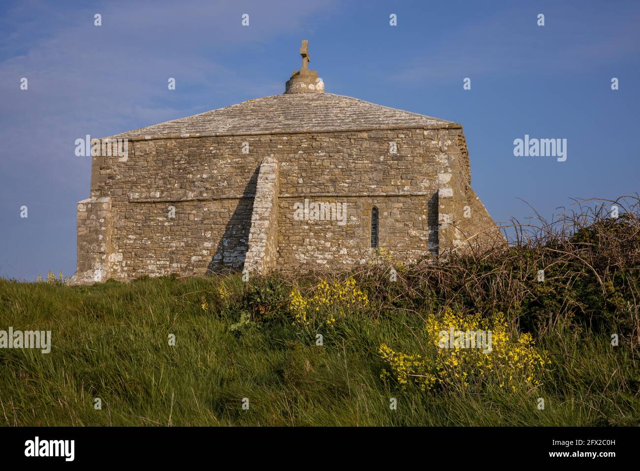 St Aldhelm's Chapel, a Norman chapel, on St Aldhelm's Head, Dorset coast. Stock Photo