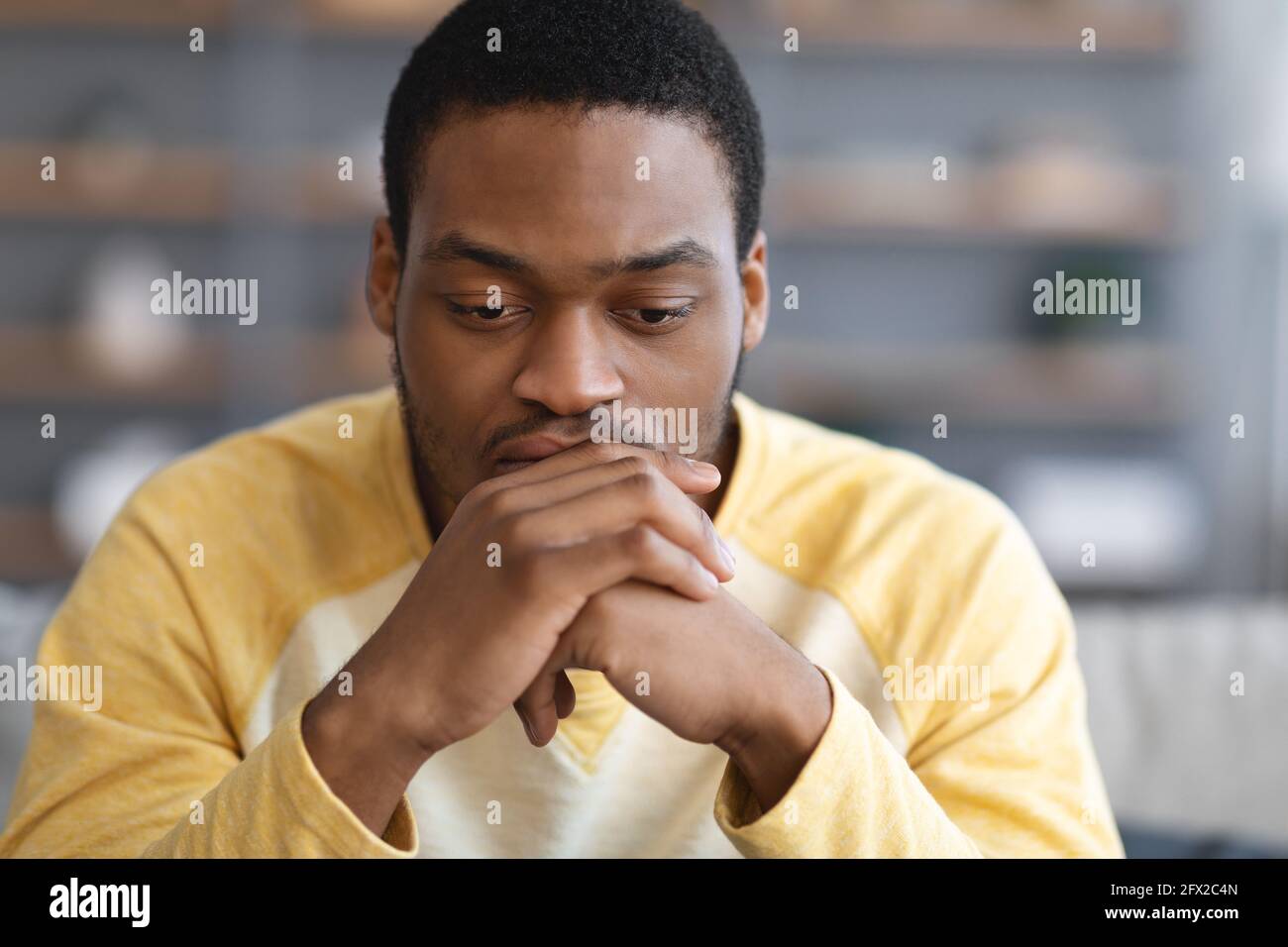 Pensive african american man thinking about something Stock Photo