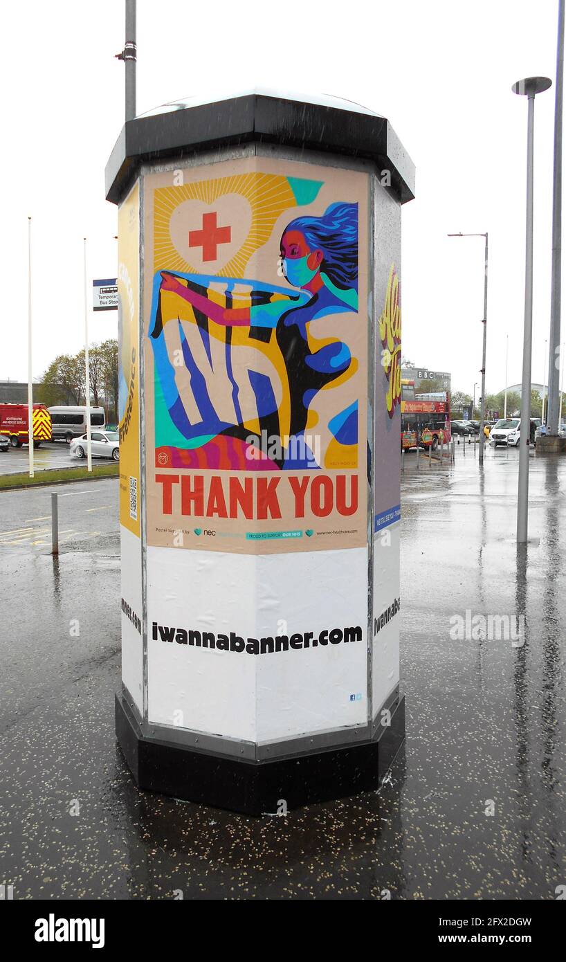 An advertising pillar has a poster on it giving thanks to the NHS for all the work they have done during the Covid 19 pandemic. Glasgow.2021. ©ALAN WYLIE/ALAMY Stock Photo